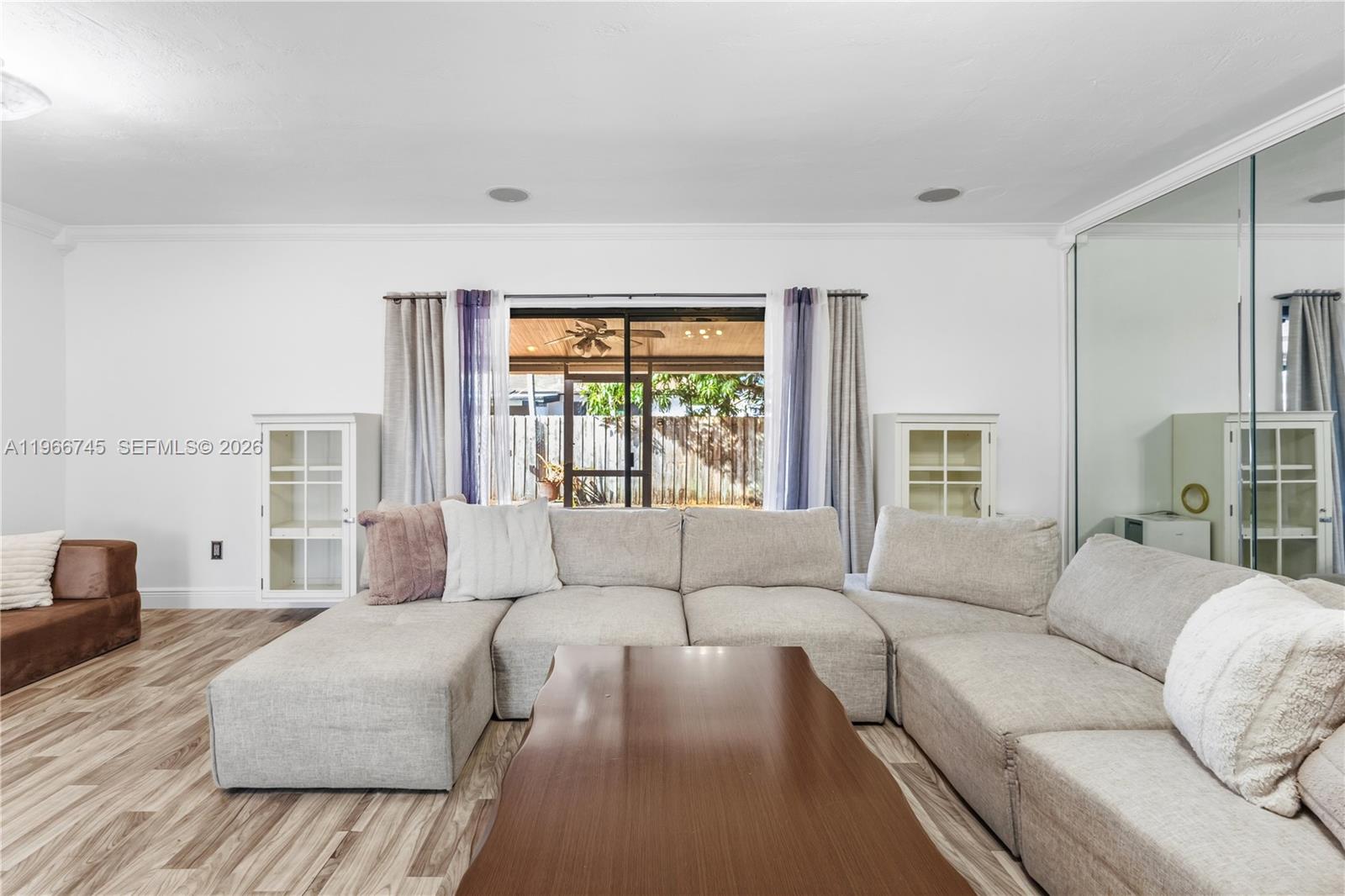 11753 Southwest 197th Street Miami, FL 33177 - Photo 14 of 36 a living room with furniture and a large window