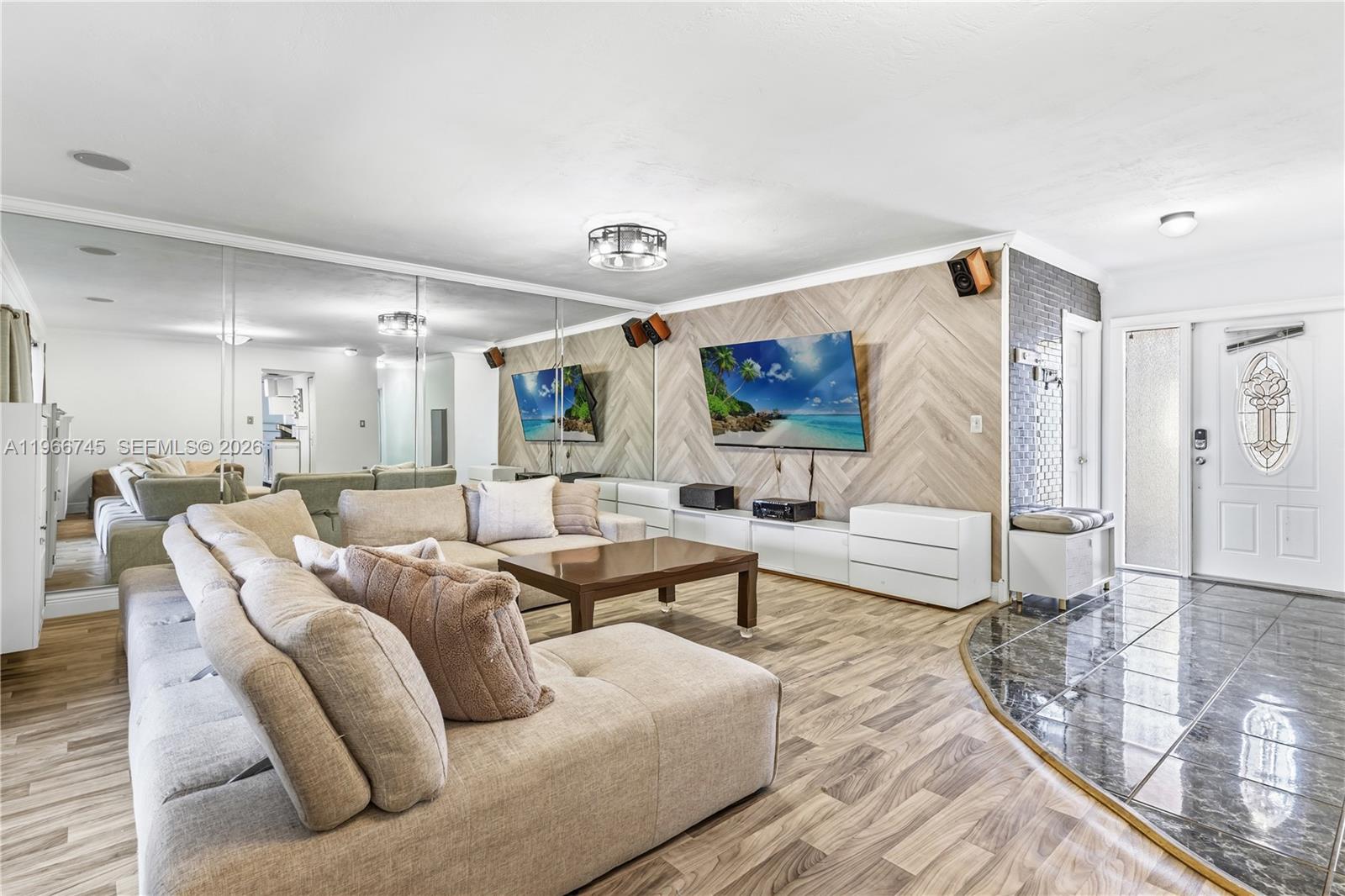 11753 Southwest 197th Street Miami, FL 33177 - Photo 15 of 36 a living room with furniture and a large window