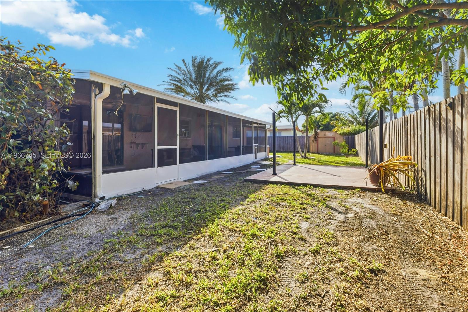 11753 Southwest 197th Street Miami, FL 33177 - Photo 19 of 36 a view of a house with backyard and garden