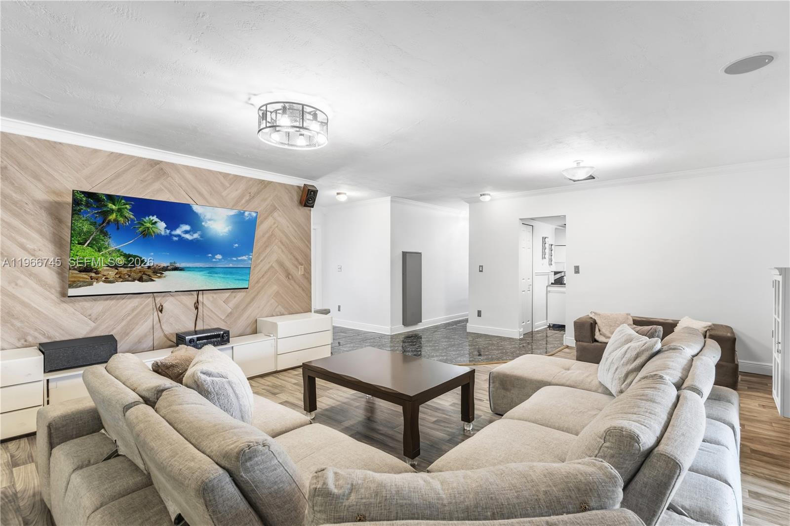 11753 Southwest 197th Street Miami, FL 33177 - Photo 2 of 36 a living room with furniture and a flat screen tv