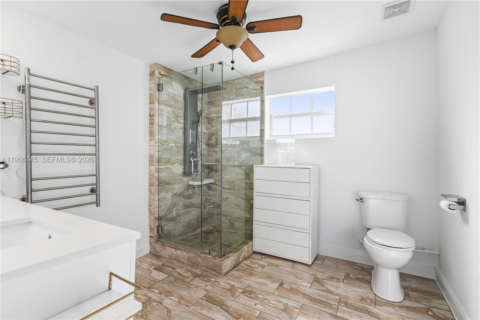 11753 Southwest 197th Street Miami, FL 33177 - Photo 23 of 36 a bathroom with a toilet sink and shower