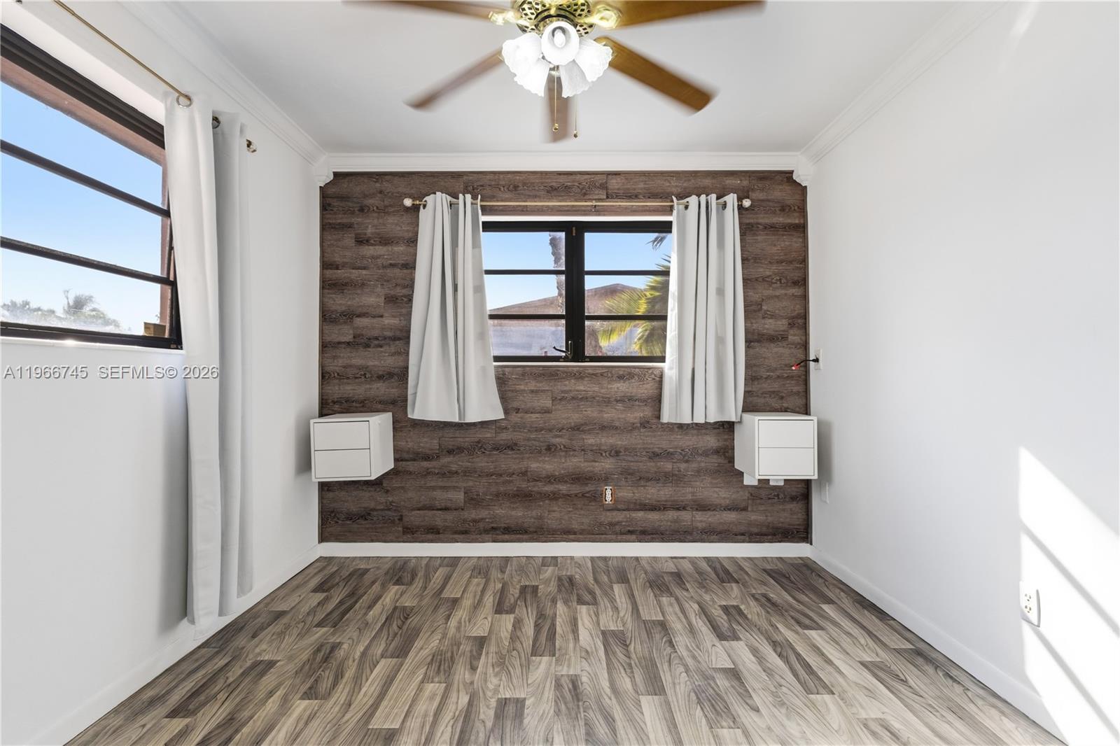 11753 Southwest 197th Street Miami, FL 33177 - Photo 25 of 36 a view of an entryway with wooden floor and a window