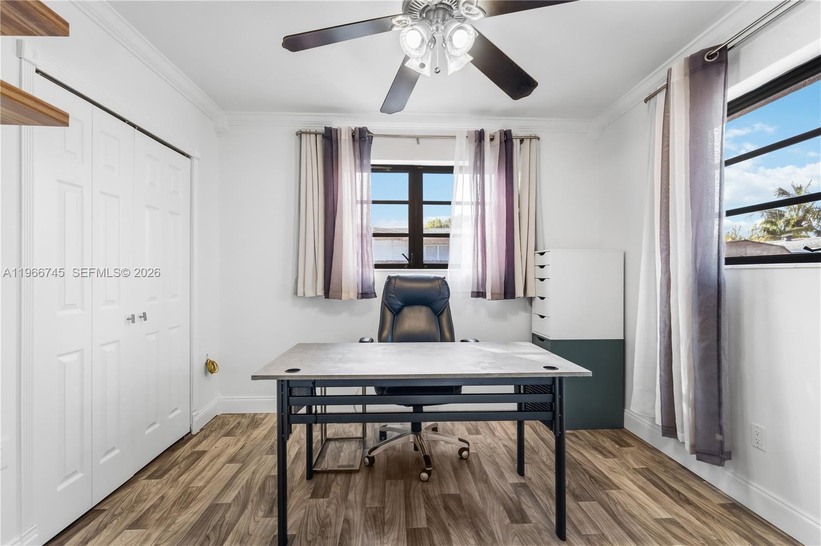11753 Southwest 197th Street Miami, FL 33177 - Photo 27 of 36 a workspace with furniture and wooden floor