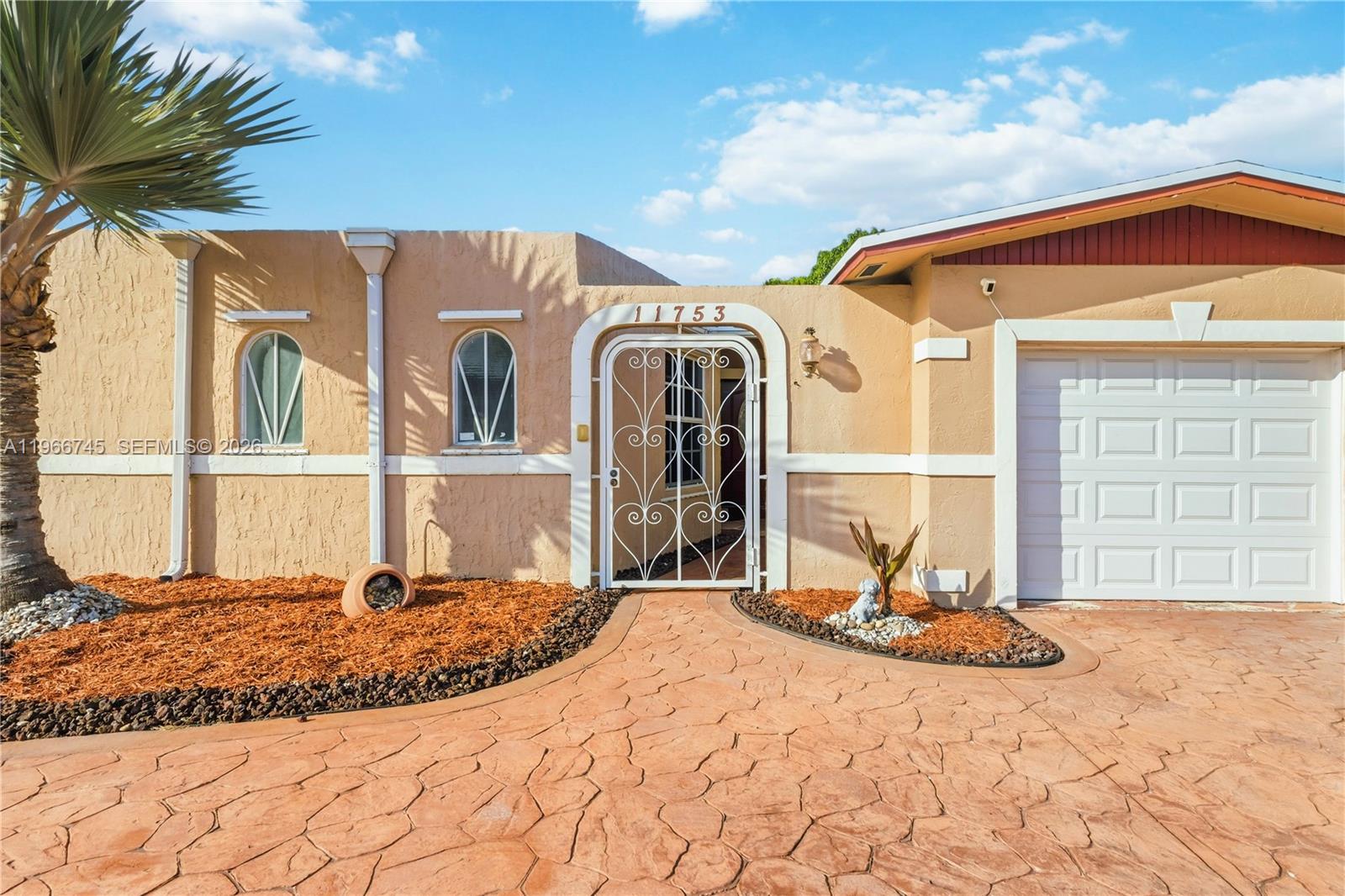 11753 Southwest 197th Street Miami, FL 33177 - Photo 29 of 36 a front view of a house