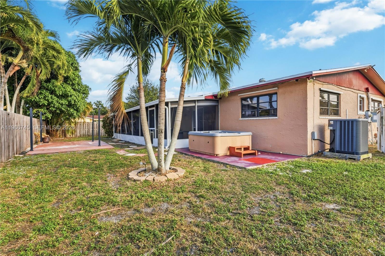 11753 Southwest 197th Street Miami, FL 33177 - Photo 30 of 36 a view of a house with backyard and sitting area