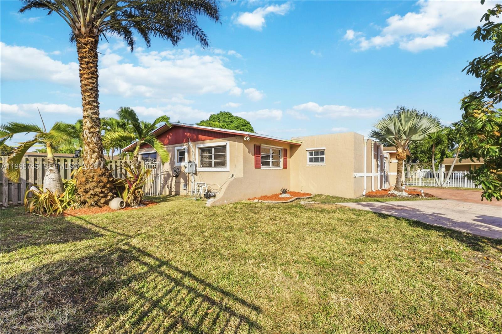 11753 Southwest 197th Street Miami, FL 33177 - Photo 33 of 36 a view of a house with a yard