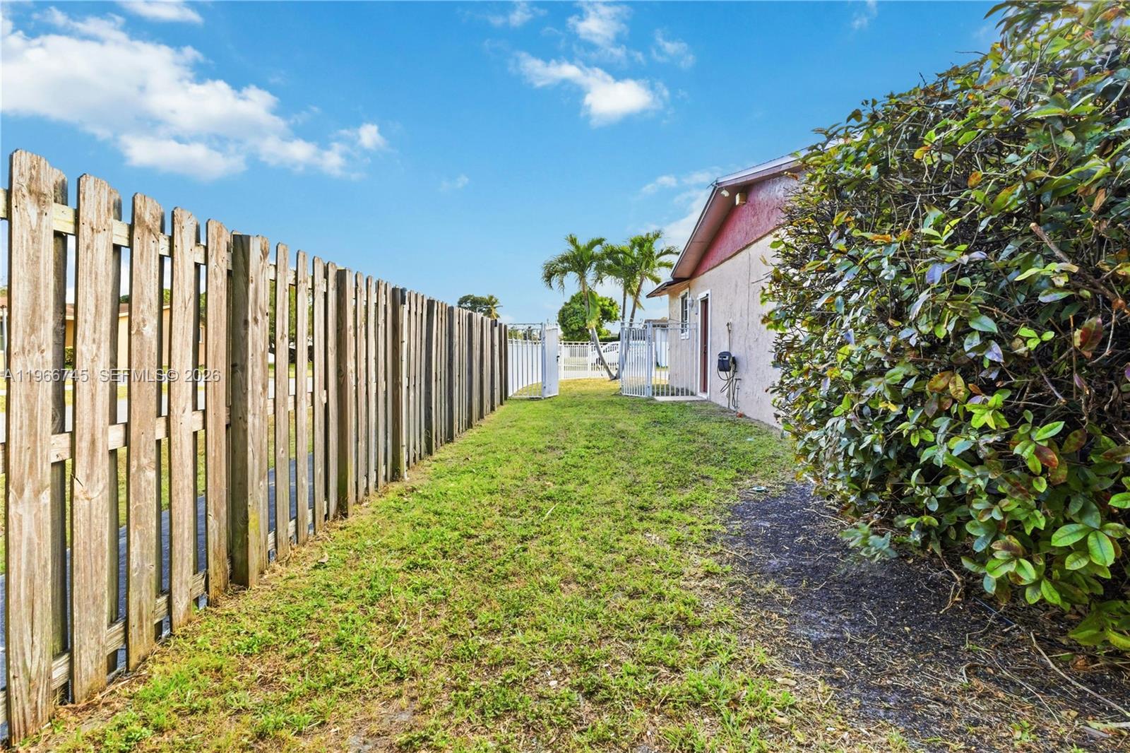 11753 Southwest 197th Street Miami, FL 33177 - Photo 35 of 36 a view of a backyard with pathway