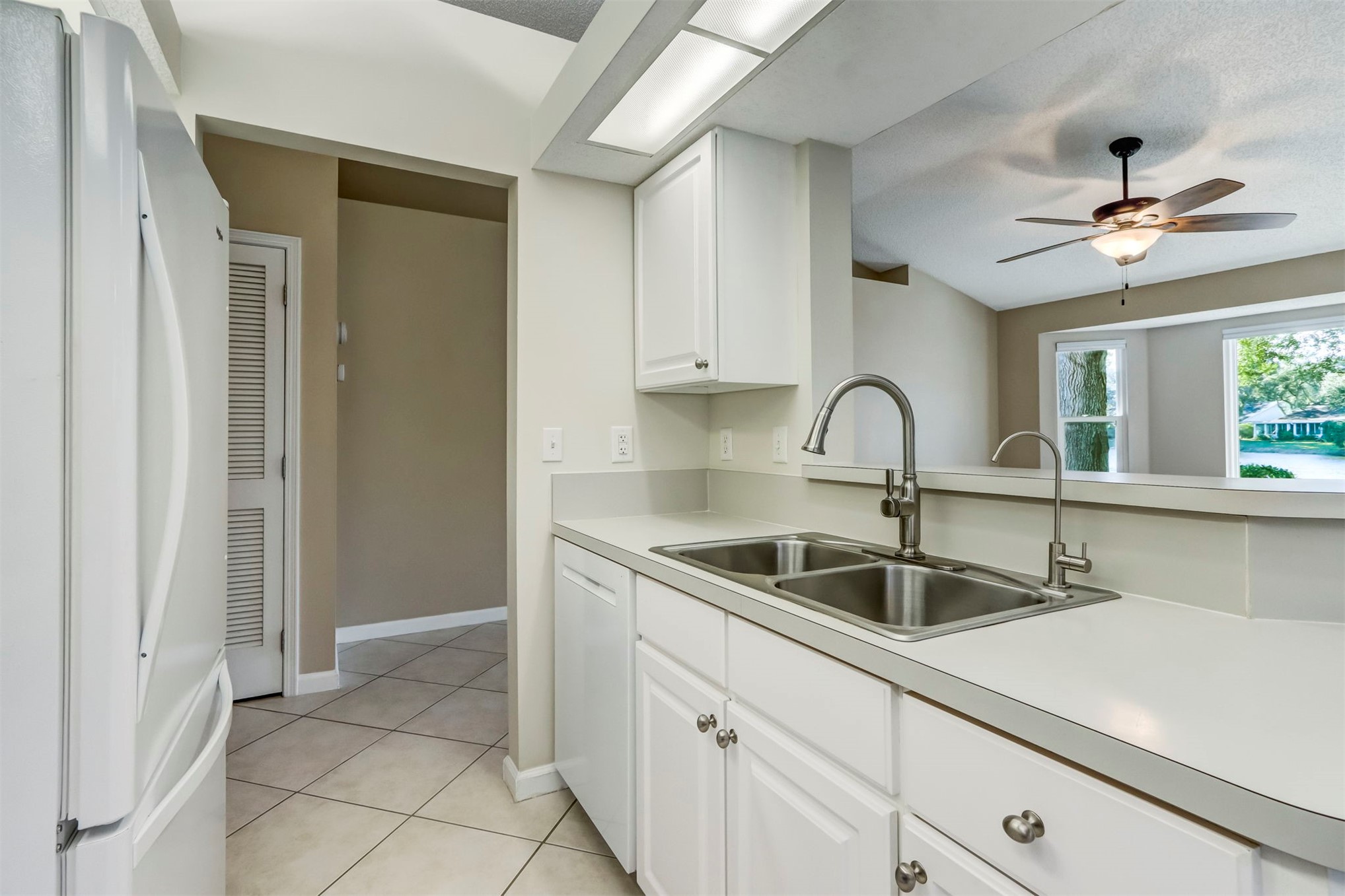 2415 Will Hardee Road Fernandina Beach, FL 32034 - Photo 26 of 59 a kitchen with a sink and cabinets