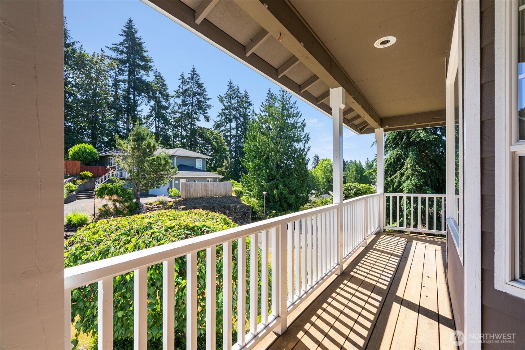 26227 Montera Loop Northeast Kingston, WA 98346 - Photo 18 of 22 a view of a balcony with wooden floor