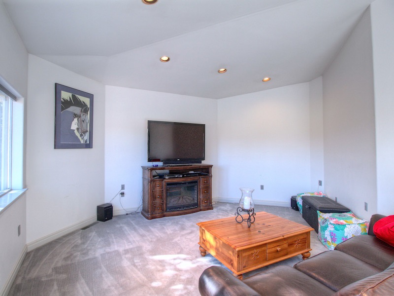 2550 I Road Grand Junction, CO 81505 - Photo 5 of 34 a living room with furniture and a flat screen tv