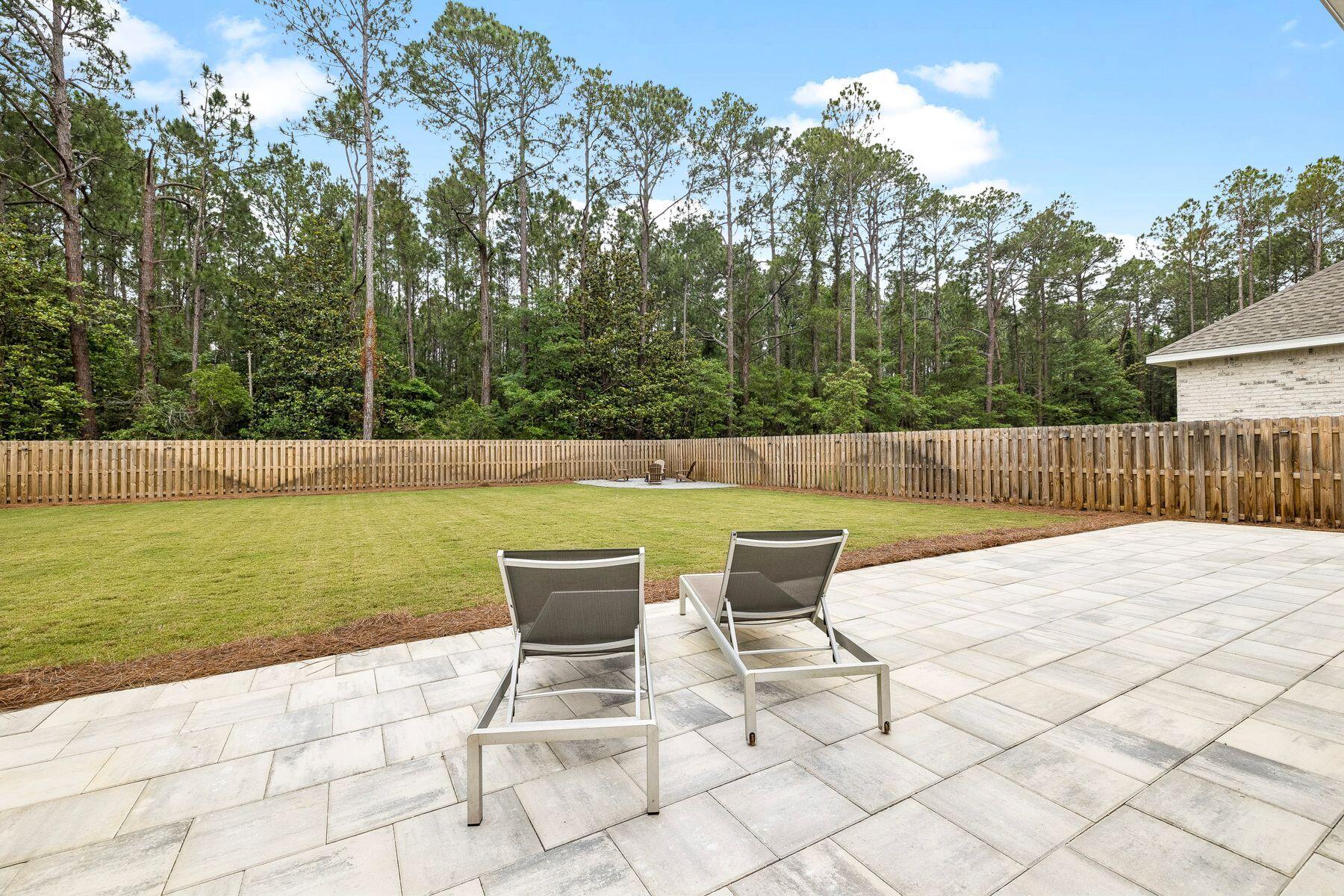 39 West Captain Fritz Way Freeport, FL 32439 - Photo 12 of 33 a view of backyard with outdoor seating