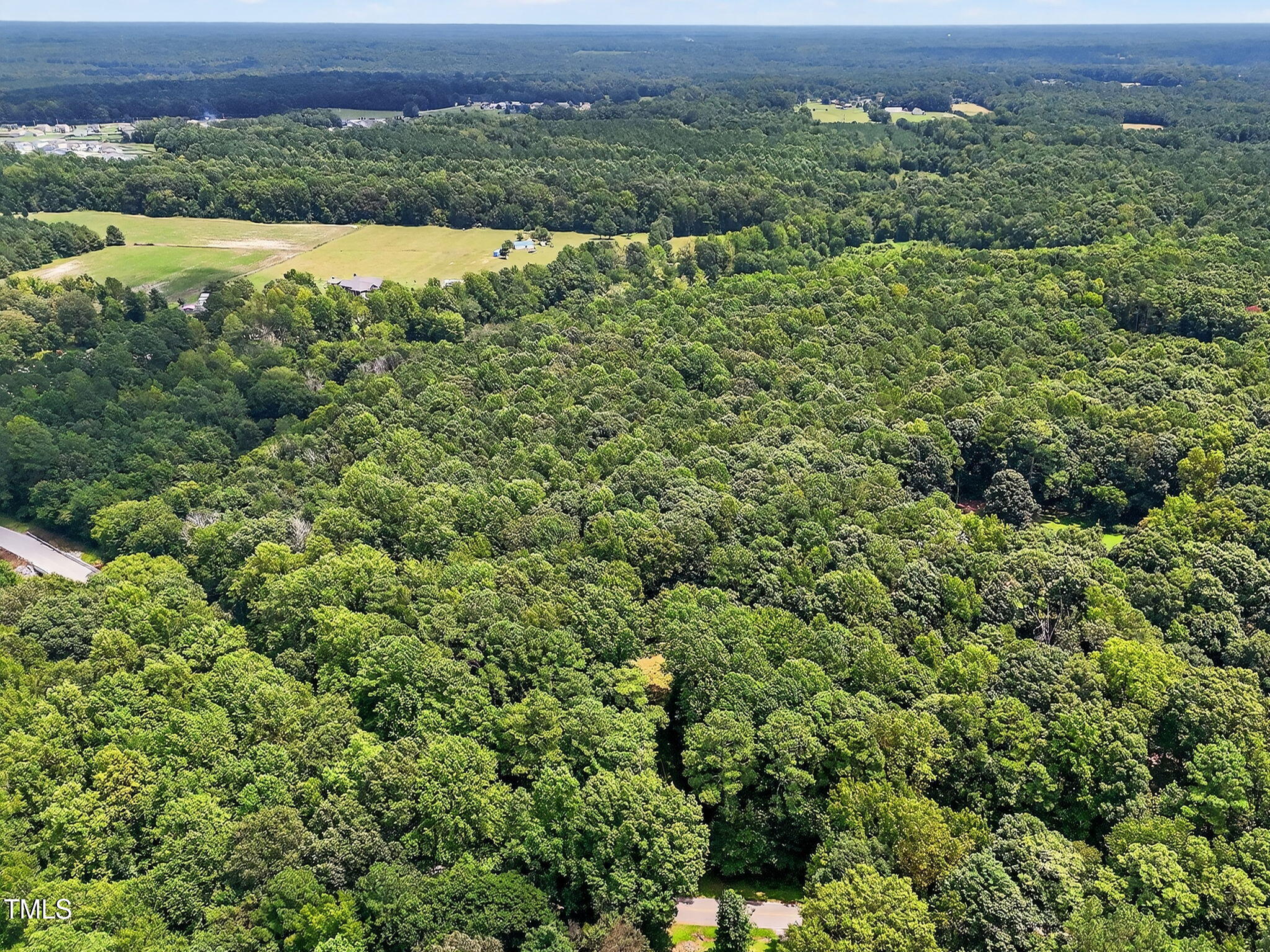 0 Eatmon Road Zebulon, NC 27597 - Photo 9 of 13 an aerial view of a houses with a yard and lake view