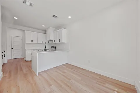 a view of kitchen with wooden floor