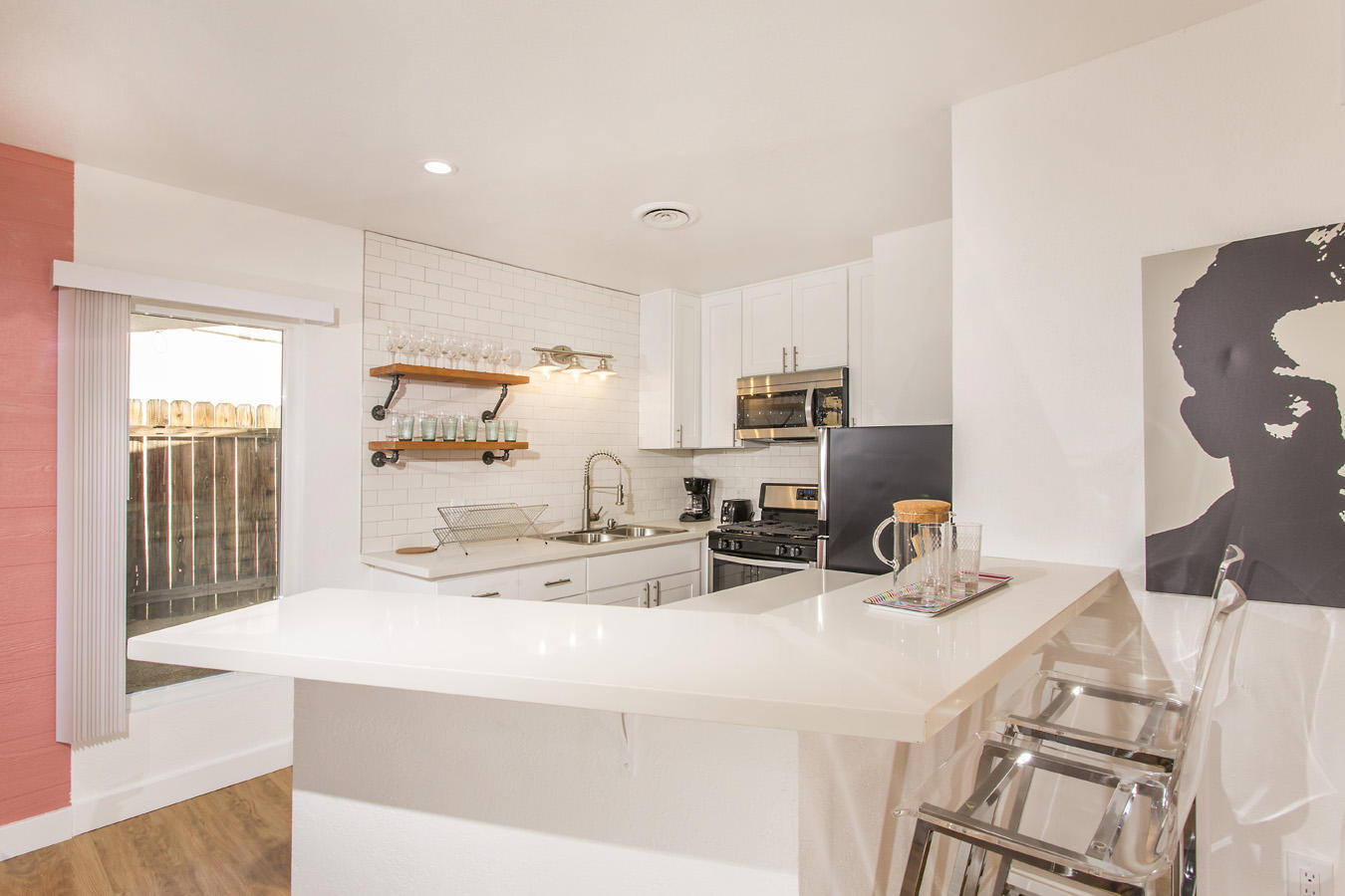 68080 Risueno Road Cathedral City, CA 92234 - Photo 46 of 98 a kitchen with stainless steel appliances kitchen island granite countertop a sink and cabinets