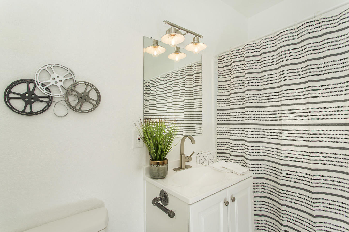68080 Risueno Road Cathedral City, CA 92234 - Photo 47 of 98 a bathroom with a sink a mirror and a window
