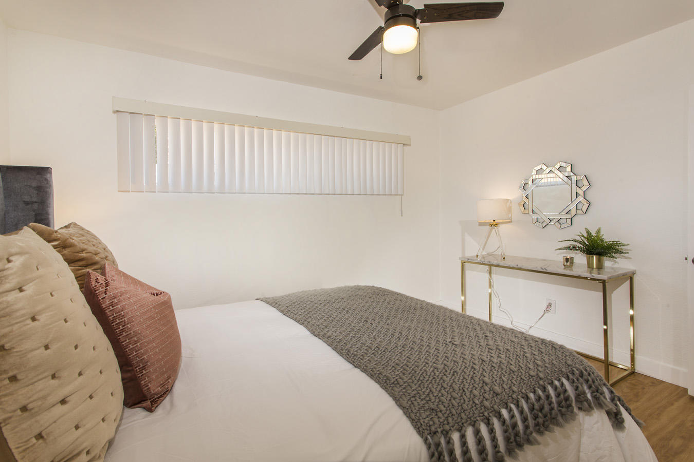 68080 Risueno Road Cathedral City, CA 92234 - Photo 56 of 98 a bedroom with a bed and chandelier