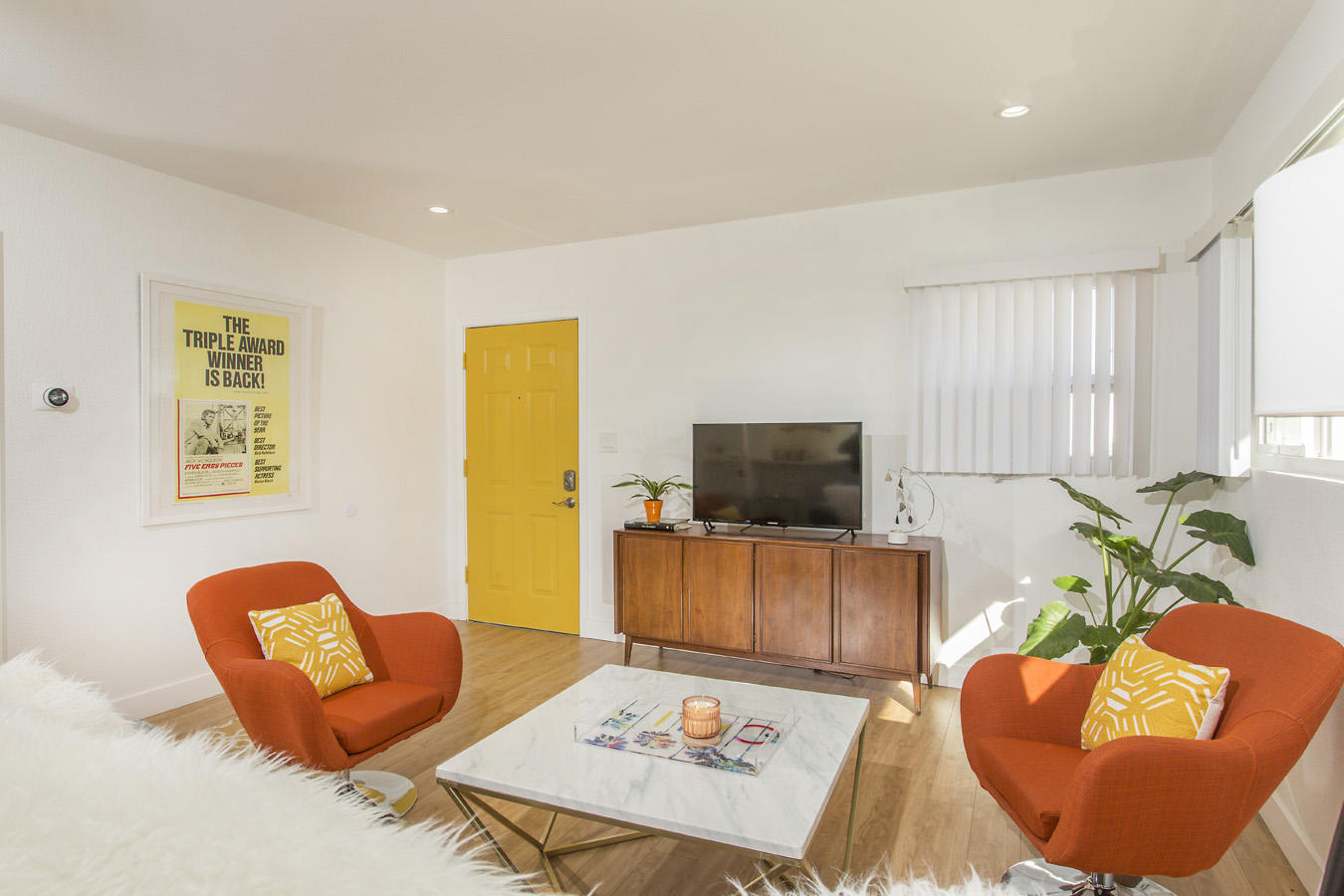 68080 Risueno Road Cathedral City, CA 92234 - Photo 7 of 98 a living room with furniture and a flat screen tv