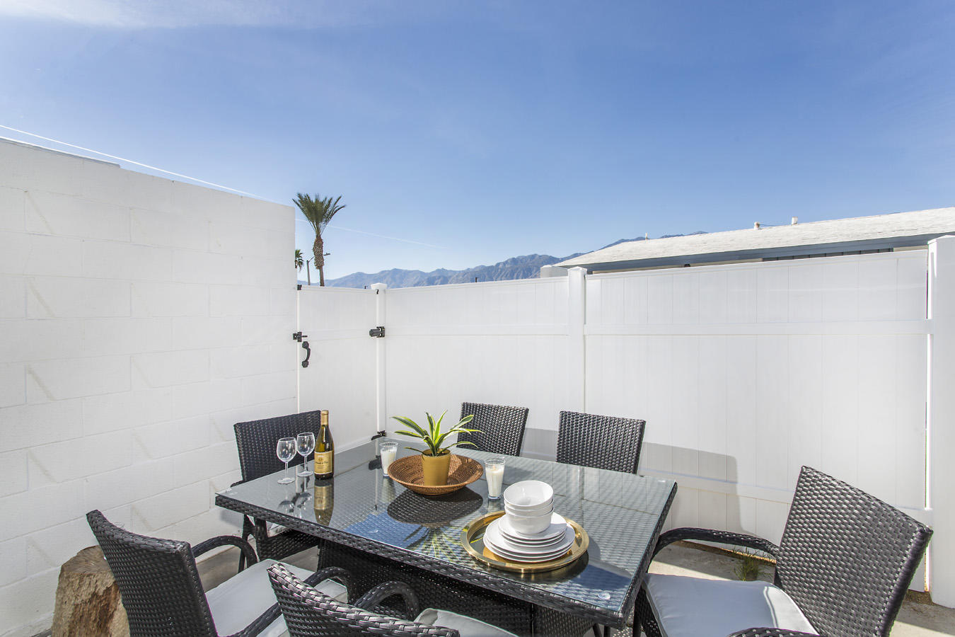 68080 Risueno Road Cathedral City, CA 92234 - Photo 69 of 98 a dining room with furniture and wooden floor