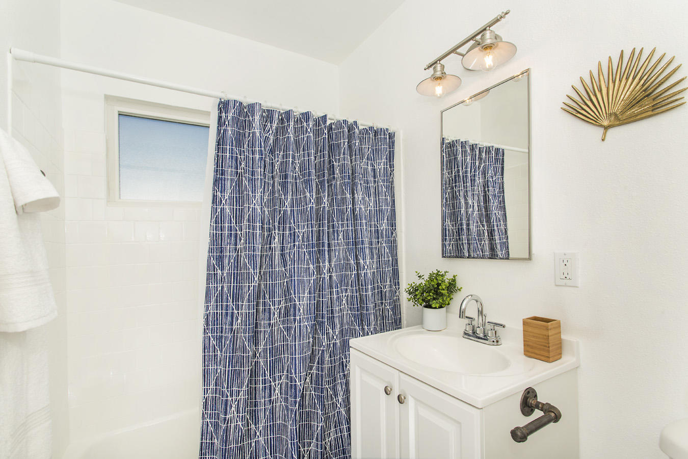 68080 Risueno Road Cathedral City, CA 92234 - Photo 71 of 98 a bathroom with a sink a mirror and shower