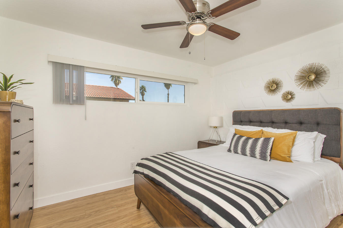 68080 Risueno Road Cathedral City, CA 92234 - Photo 73 of 98 a bedroom with a bed and wooden floor