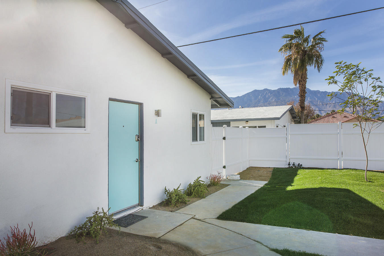 68080 Risueno Road Cathedral City, CA 92234 - Photo 82 of 98 a front view of a house with a garden and yard
