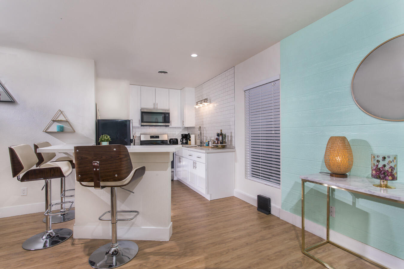 68080 Risueno Road Cathedral City, CA 92234 - Photo 88 of 98 a kitchen with stainless steel appliances kitchen island granite countertop a stove a sink and a microwave