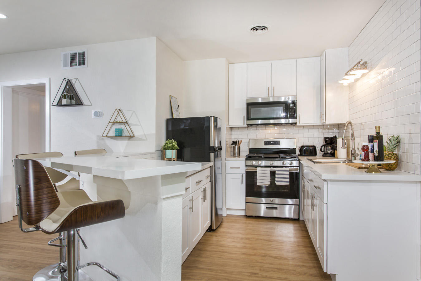 68080 Risueno Road Cathedral City, CA 92234 - Photo 90 of 98 a kitchen with granite countertop a stove top oven sink and cabinets