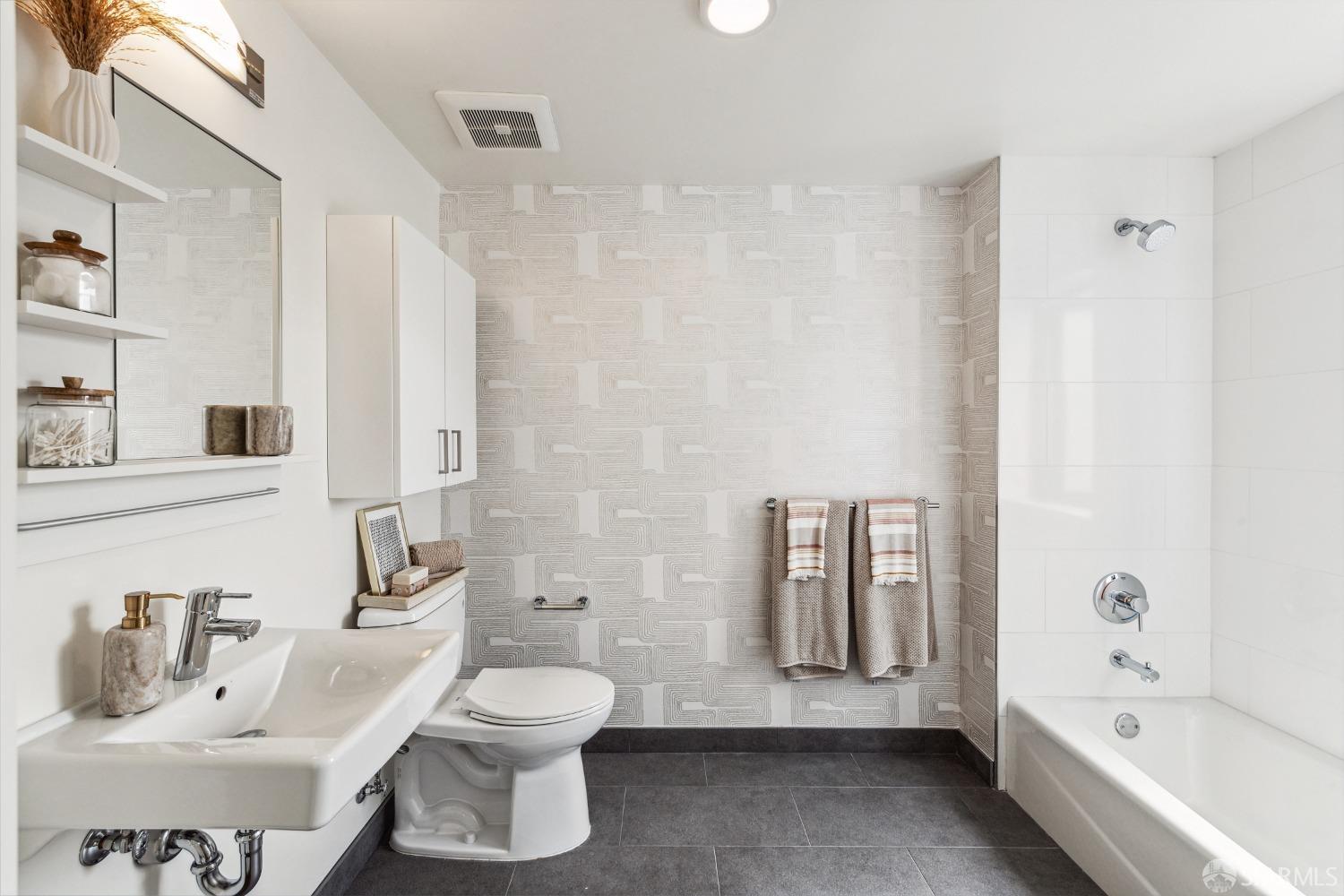 1201 Sutter Street, Unit PH603 San Francisco, CA 94109 - Photo 5 of 13 a bathroom with a toilet sink and bathtub