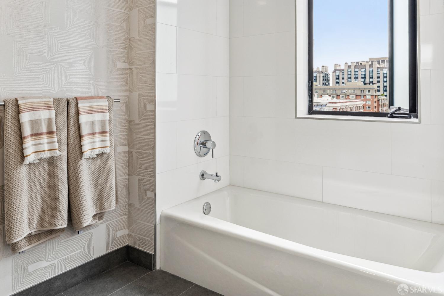 1201 Sutter Street, Unit PH603 San Francisco, CA 94109 - Photo 6 of 13 a white bath tub sitting next to a window
