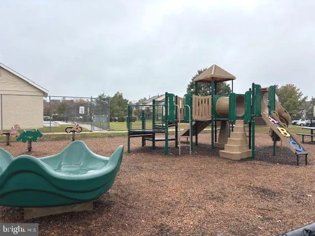 a view of a swimming pool with outdoor seating