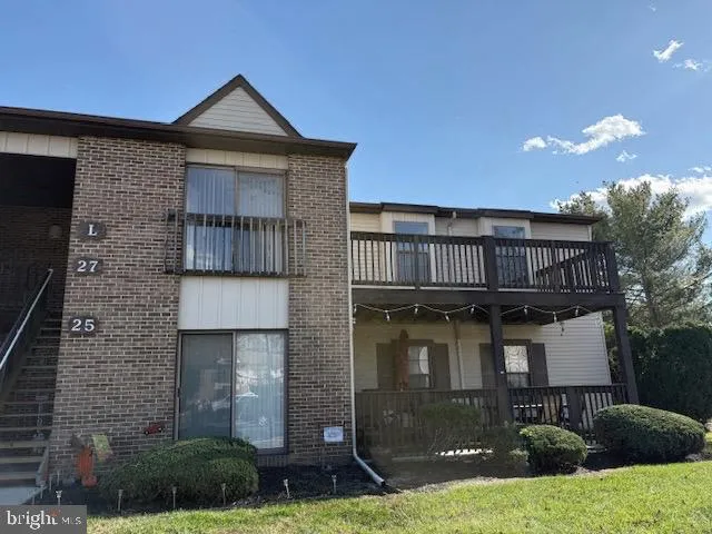 a front view of a house with yard