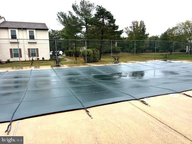 a view of swimming pool with a yard