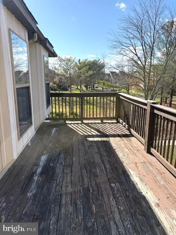 a view of balcony with wooden floor