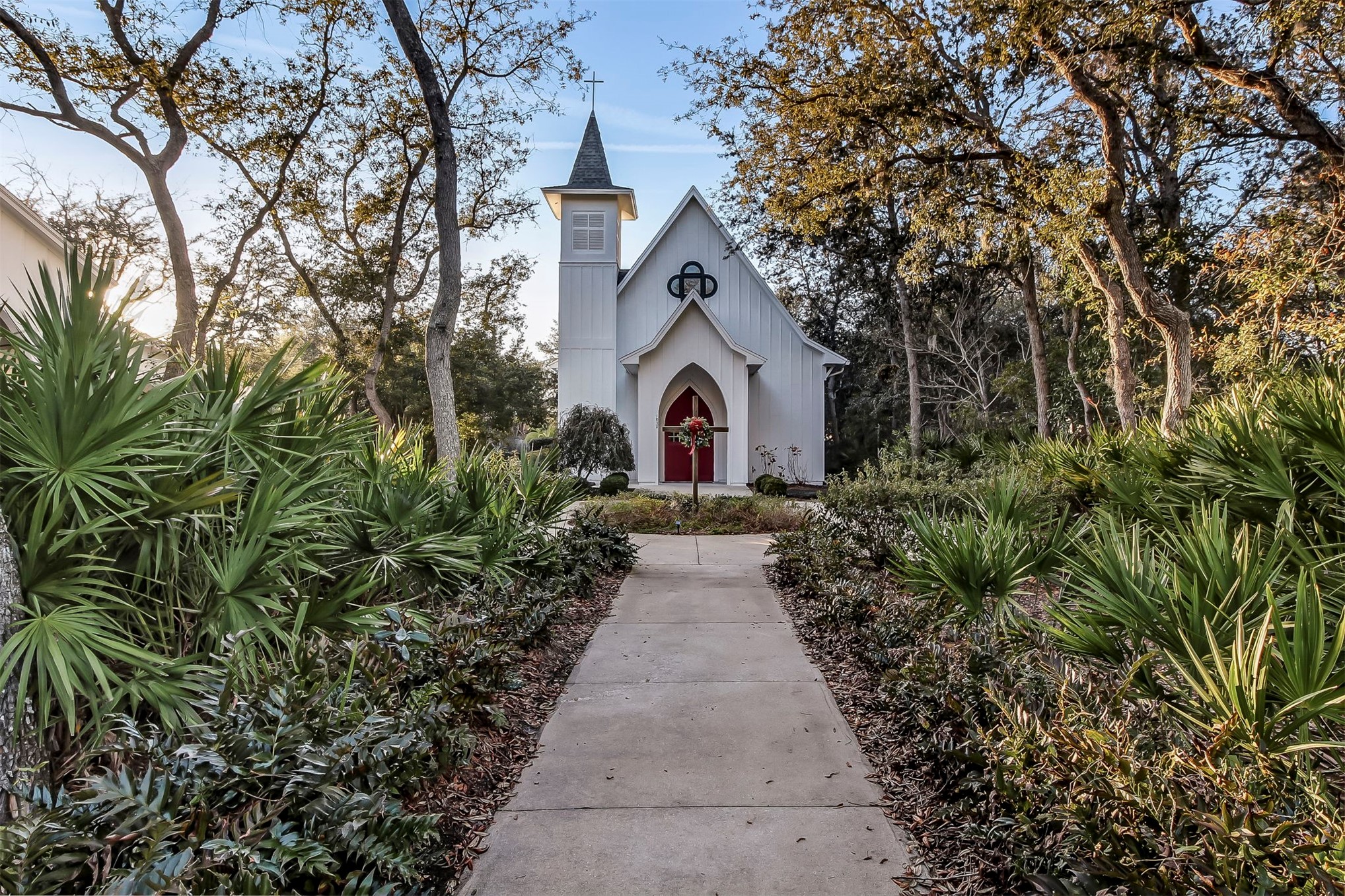 1839 Perimeter Park Road West, Unit 210 Fernandina Beach, FL 32034 - Photo 35 of 37 a view of a house with a small yard and large trees