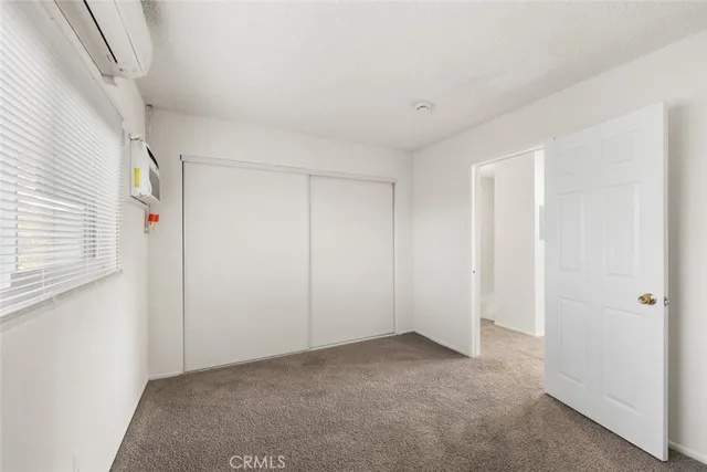 a view of a hallway with closet