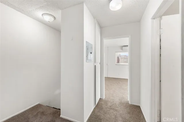 a bathroom with a granite countertop sink mirror vanity and toilet
