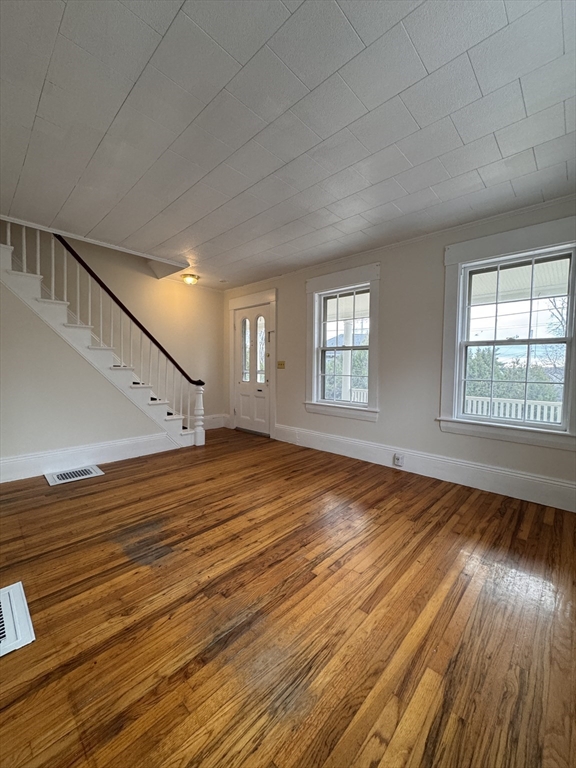 68 Cottage Street, Unit 68 Newton, MA 02464 - Photo 2 of 16 a view of empty room with wooden floor and fan