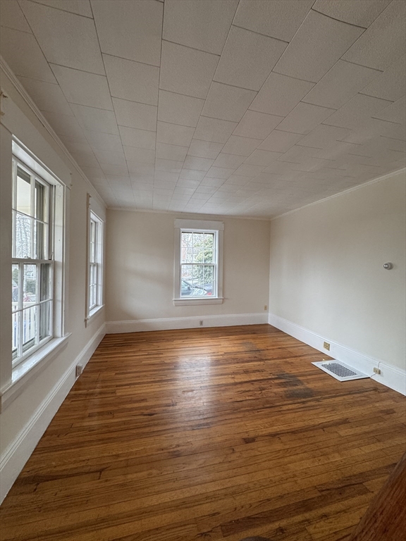 68 Cottage Street, Unit 68 Newton, MA 02464 - Photo 4 of 16 a view of empty room with wooden floor and fan
