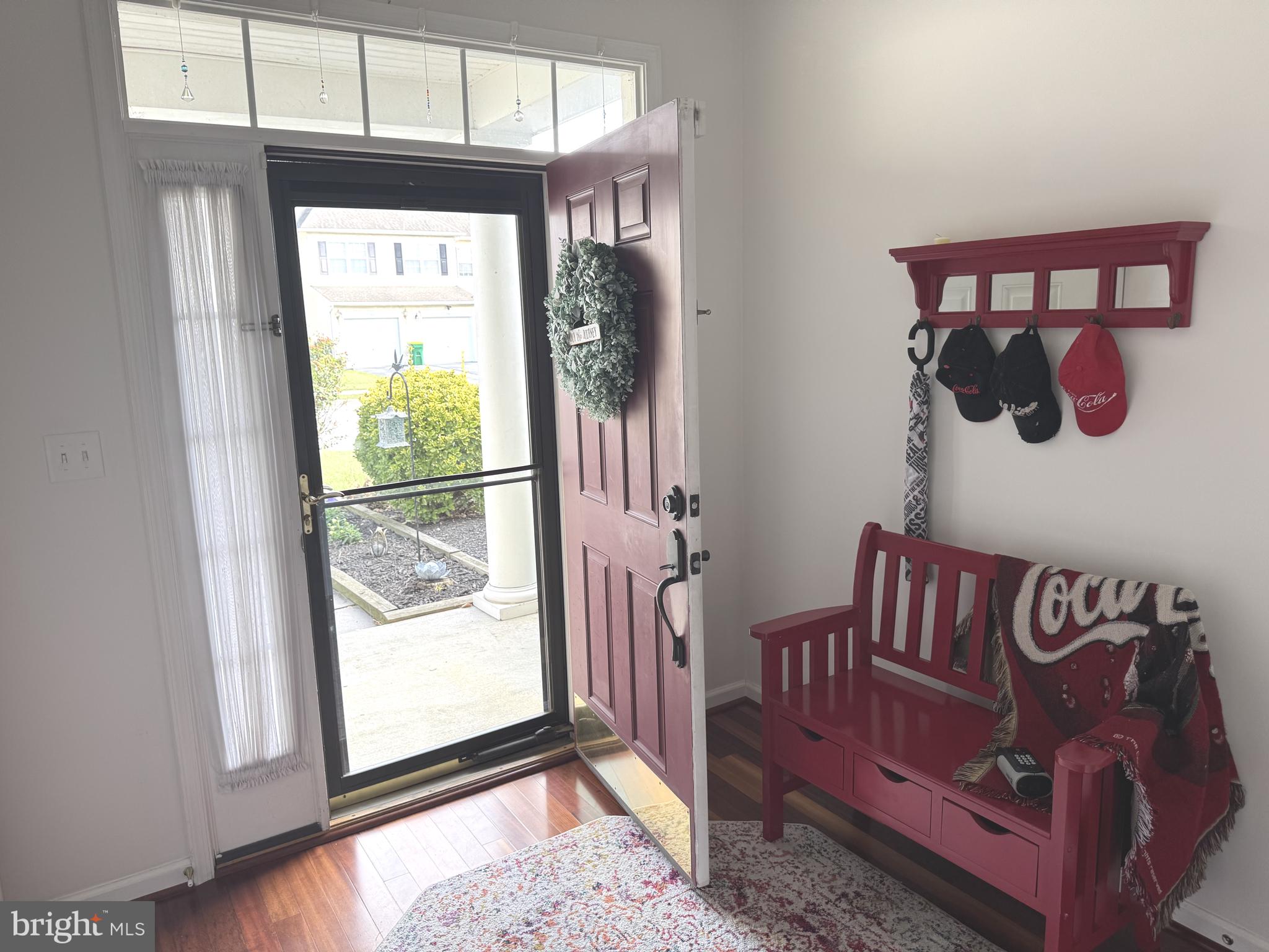 189 Gillespie Avenue Middletown, DE 19709 - Photo 3 of 62 a view of a hallway with wooden floor and windows