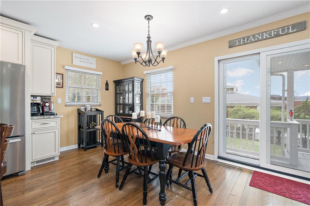 349 Backbone Road Sewickley, PA 15143 - Photo 12 of 25 a view of a dining room with furniture window and wooden floor