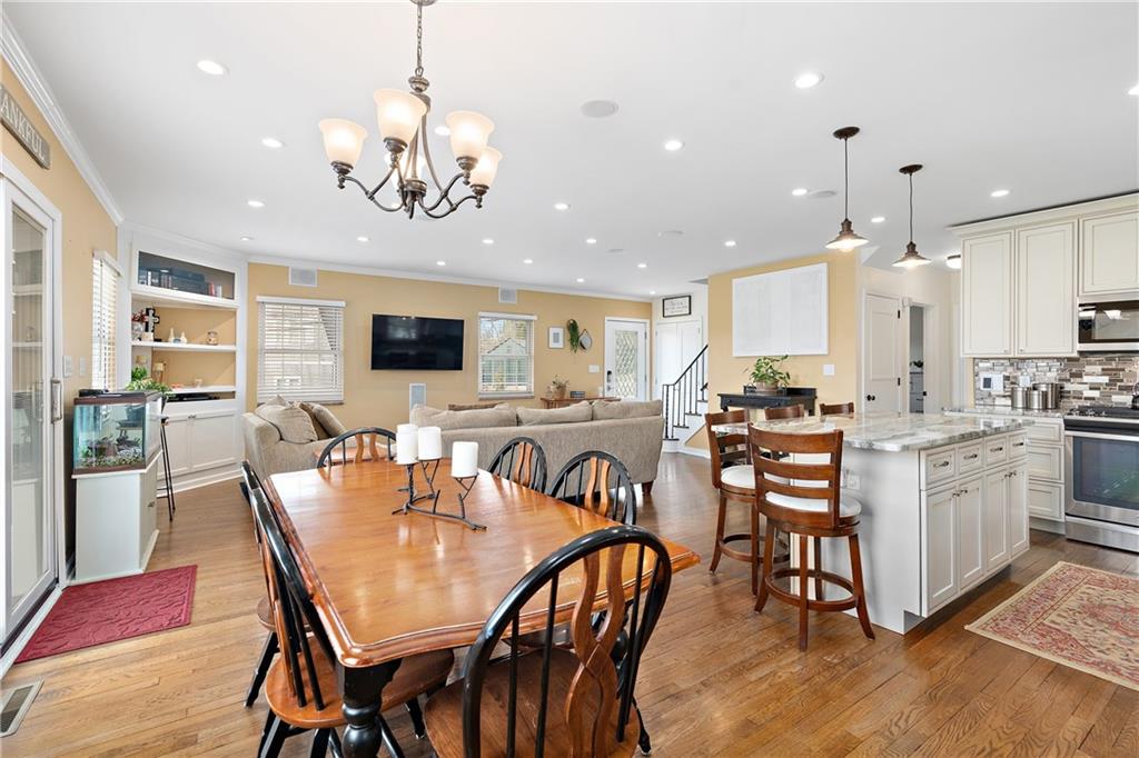 349 Backbone Road Sewickley, PA 15143 - Photo 13 of 25 a view of a dining room with furniture and a chandelier