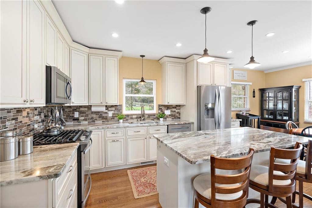 349 Backbone Road Sewickley, PA 15143 - Photo 9 of 25 a kitchen with a sink stove and refrigerator