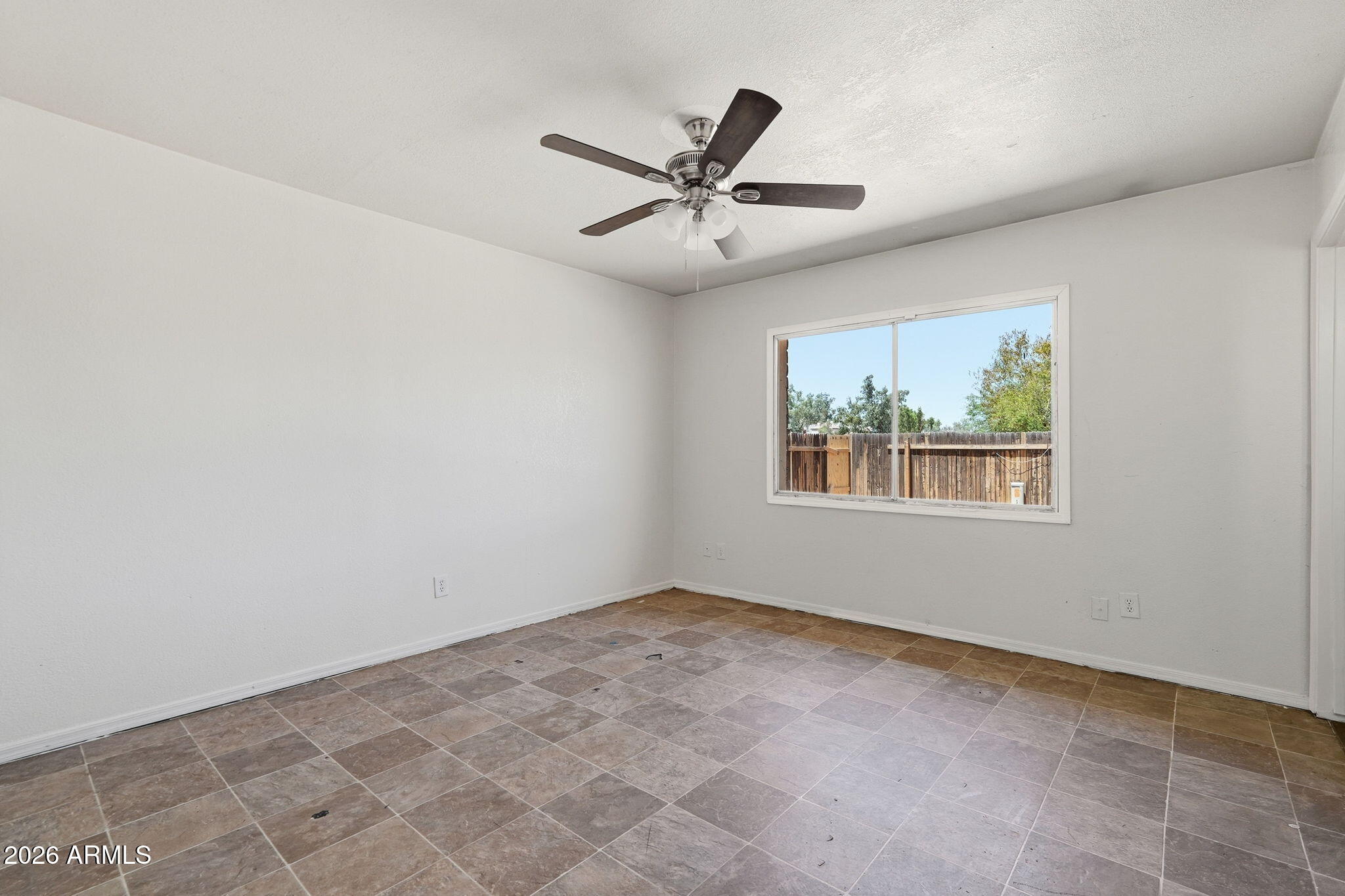 6452 West Thomas Road Phoenix, AZ 85033 - Photo 14 of 30 a view of an empty room with a window