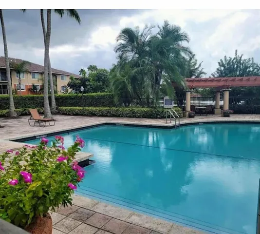 a view of a swimming pool with a patio
