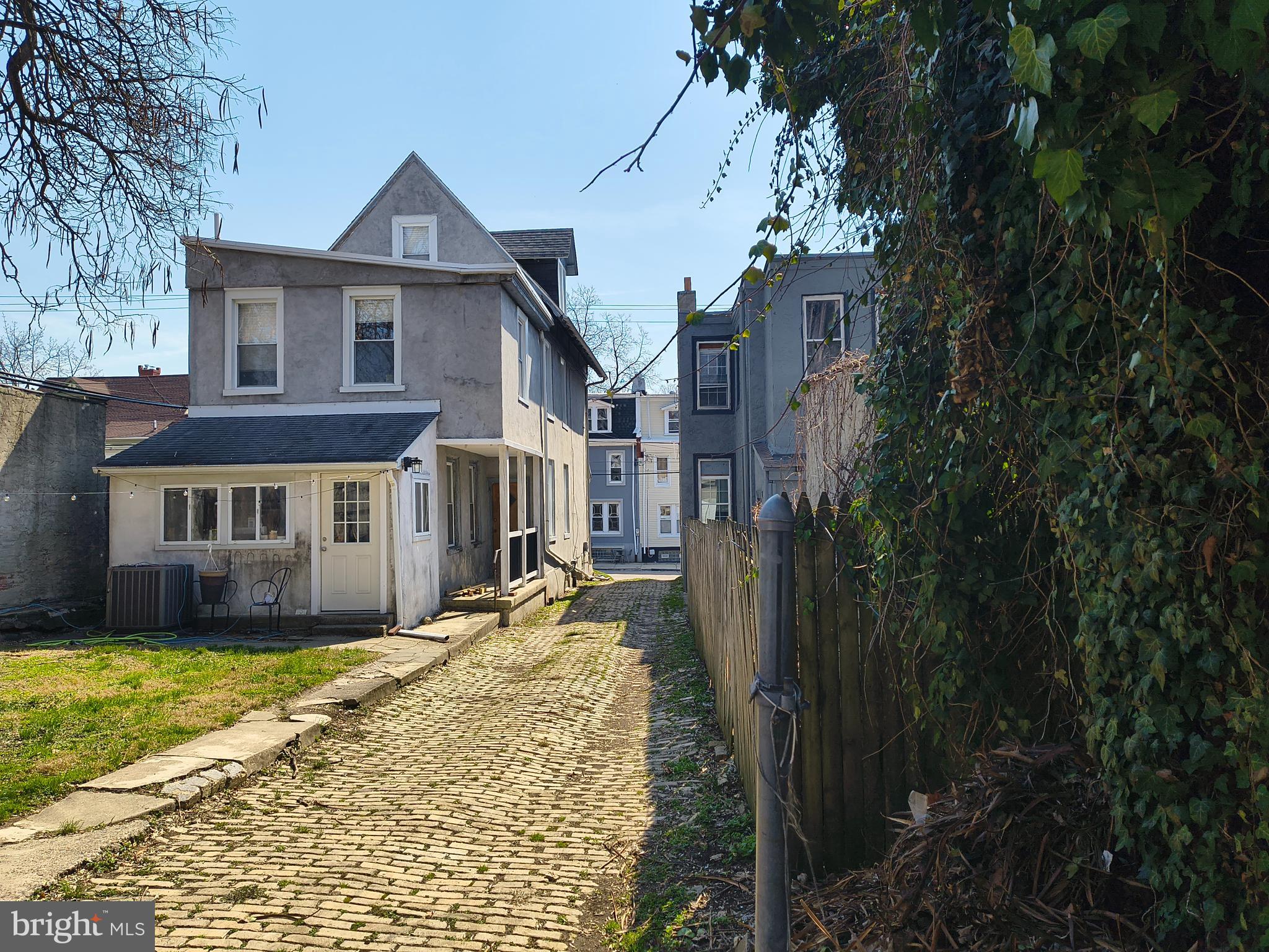 222 West Johnson Street Philadelphia, PA 19144 - Photo 6 of 12 a view of a big house with a big yard and large tree