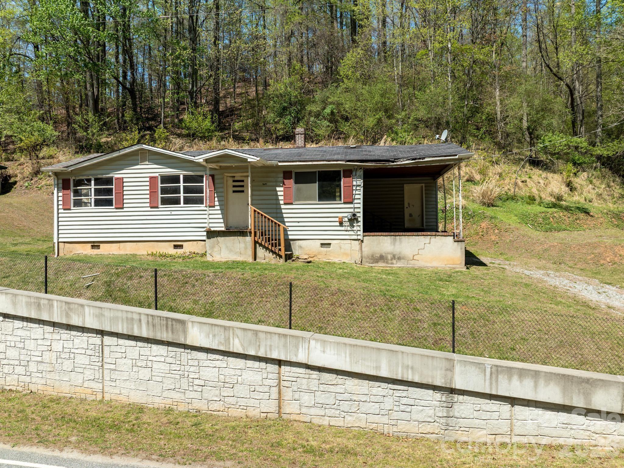 2687 Indian Grave Road Lenoir, NC 28645 - Photo 2 of 31 a front view of a house with garden