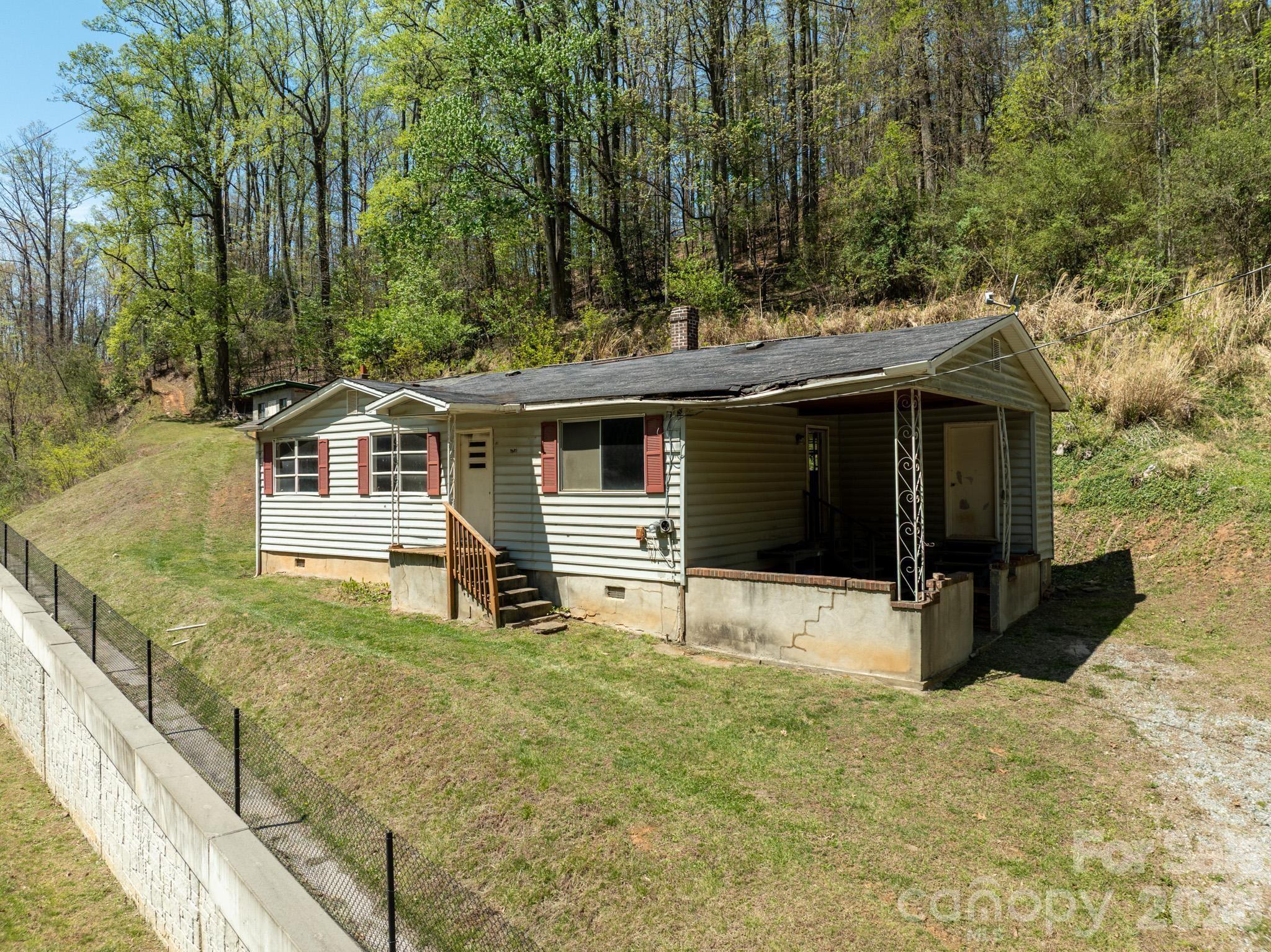 2687 Indian Grave Road Lenoir, NC 28645 - Photo 3 of 31 a front view of a house with garden