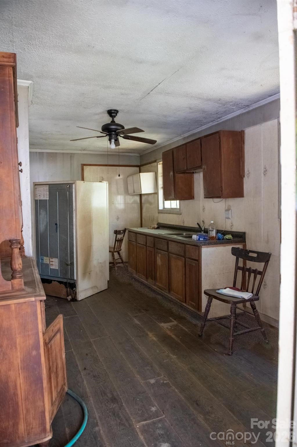 2687 Indian Grave Road Lenoir, NC 28645 - Photo 6 of 31 a kitchen with granite countertop a sink cabinets and stainless steel appliances