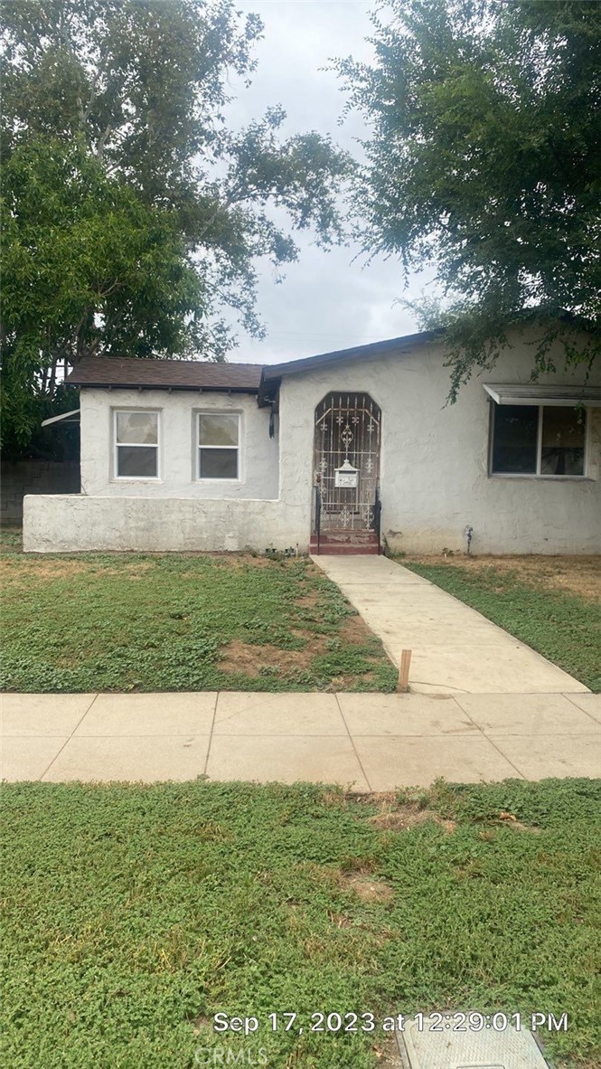 4661 Marmian Way Riverside, CA 92506 - Photo 1 of 1 a front view of a house with a yard