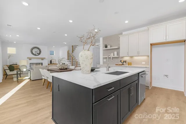 a kitchen with a sink a counter top space and appliances